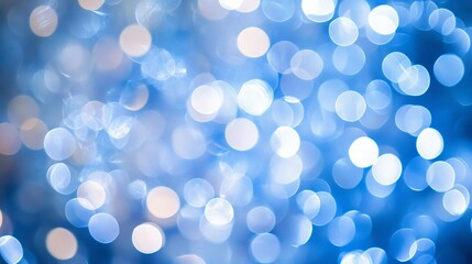 Soft white bokeh circles on blue background, abstract light blur effect