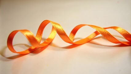 Orange Satin Ribbon Curls on a White Background