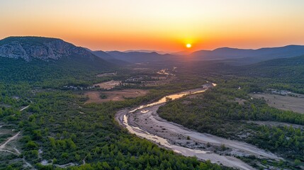 Fototapeta premium Stunning Aerial View of a Serene River at Sunset in a Scenic Landscape
