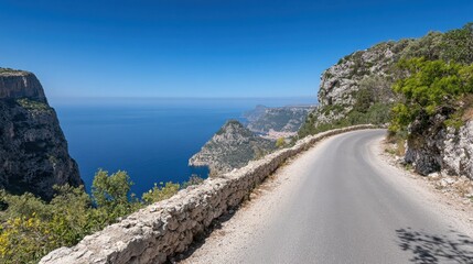 Scenic Coastal Road with Rocky Cliffs and Ocean View in Summer