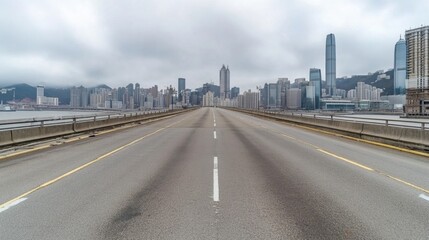 Fototapeta premium Urban Skyscraper View from Empty Road with Cloudy Sky in Hong Kong