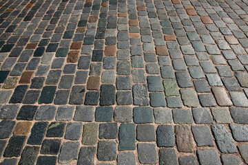 Fototapeta premium Stone pavement texture. Granite cobblestoned pavement background. Pavement texture.