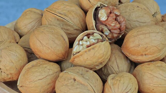 Fresh healthy walnuts in bowl wooden