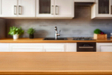 Kitchen wood table top for product display with blurred modern interior. Wooden tabletop over...