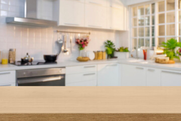 Kitchen wood table top for product display with blurred modern interior. Wooden tabletop over...