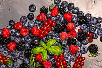 Wild berries background. Blueberry, raspberries, blackberry. Background of berries. Summer berries background. Mixed berries background.