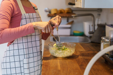 Asian woman preparing vegetable salad in the kitchen Healthy Food Healthy Cooking dieting Weight loss  homemade salad healthy