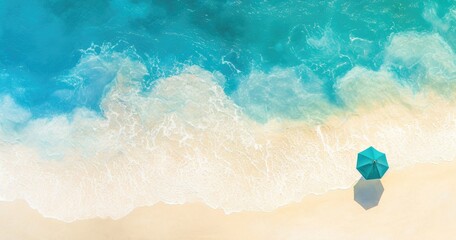 Fototapeta premium A serene beach scene featuring turquoise water, soft sand, and a lone umbrella.