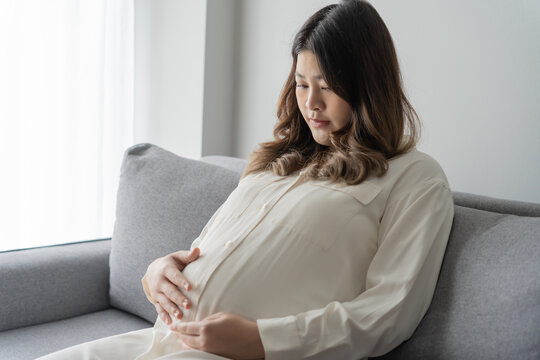 worried pregnant woman concerned and anxious woman in pregnancy overthinking worrying about pregnancy problem Pregnancy depression Mental health