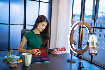 Content creator Young asian woman influencer creating content in home studio entertainment and...