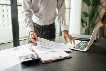 Auditor or internal revenue service staff, Business men checking annual financial statements of...
