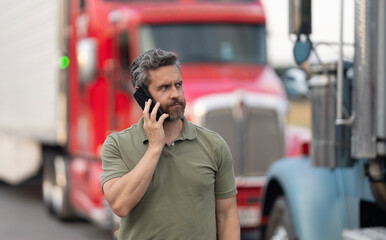 Mature man Hispanic truck driver and owner having phone call outdoor