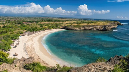 Serene Tropical Beach with Clear Blue Water and Lush Green Landscape