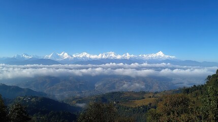 Scenic Snow-Capped Mountain Range with Blue Sky and Clouds