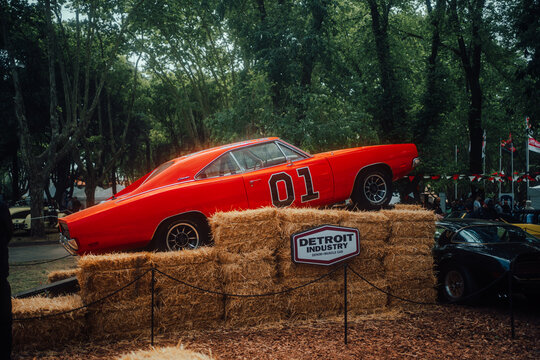 Classic muscle car. Orange 1969 Dodge Charger General Lee from the Dukes of Hazzard over hay bales. AutoClasica