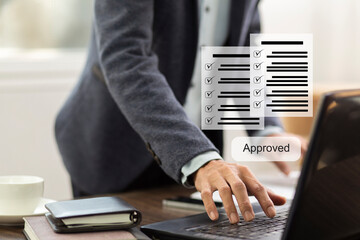 businessman work with laptop and  review document checklist with approved at workplace in office, process document management system concept