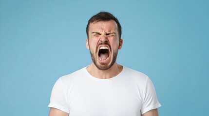 Obraz premium Frustration and resentment concept with expressive man on blue background