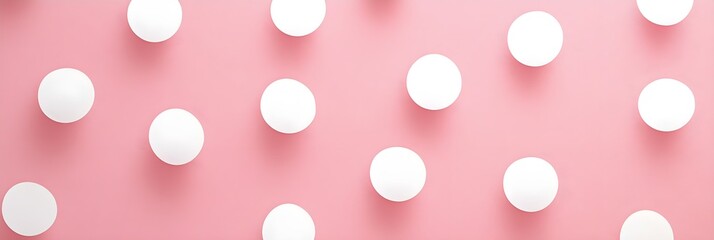 A seamless polka dot pattern with white dots on a light pastel pink background for a playful, clean design. 