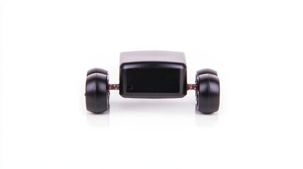 A minimalist black gadget on wheels, featuring a rectangular body and smooth wheels, suggesting mobility and compact design.