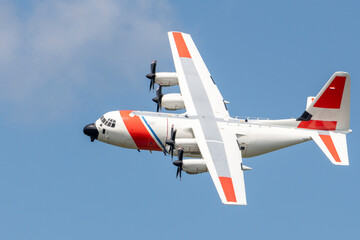 The U.S. Coast Guard C-130J aircraft soars through the sky, designed for search-and-rescue missions...