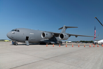 U.S. Air Force C-17 Globemaster III under a clear blue sky.