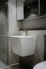 Hotel-like bathroom interior decorated with dark lighting
