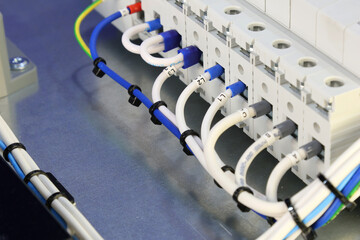 Connection of electrical modules using insulated mounting wires. Close-up. Soft focus.