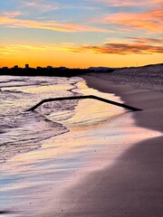 colorful sunset on the beach reflected in the water