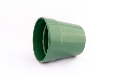 Glossy green ceramic cache pot on white isolated background