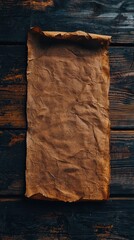 Rustic brown parchment on dark wood with warm lighting