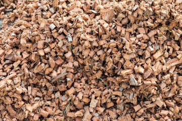 Closeup coco husk chips block background, gardening material, outdoor day light