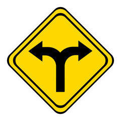 the road forks. warning road sign on a yellow and black board in the shape of a rhombus.