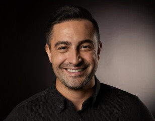 Fototapeta premium Smiling Hispanic Man Headshot in Studio