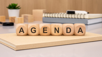 Wooden Blocks that Spell Out an Agenda Beautifully Displayed on a Chic Minimalist Desk Setup