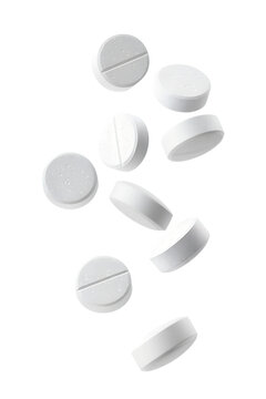 White pills floating in mid air isolated on transparent background