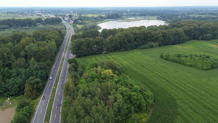 Cars on scenic road near river