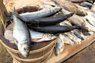 A basket full of fish is on a table