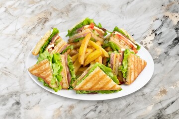 Tasty fresh sandwiches with vegetables on the desk