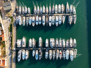 Aerial view of a marina with anchored yachts and sail boats