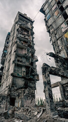 Naklejka premium destroyed and burned houses in the city in Ukraine