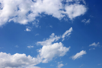 White clouds in azure sky background
