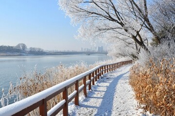 Obraz premium A lake with rime and trees, a wooden guardrail path leading to the water's surface, covered in white snow on both sides of the road,