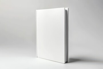 White notebook closed and standing upright against a neutral background