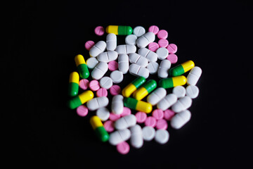 pills on black background