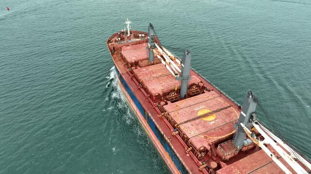 Aerial view of dry cargo ship. Bulk carrier cargo vessel. Ship logistic and transportation business industry.