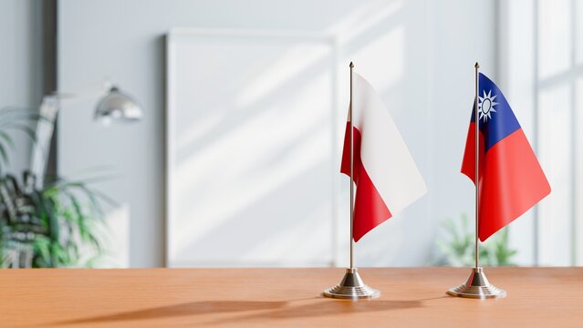 FLAGS OF POLAND AND TAIWAN ON TABLE
