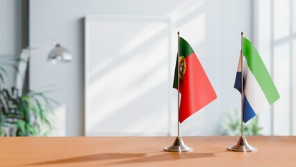 FLAGS OF PORTUGAL AND SIERRA LEONE ON TABLE