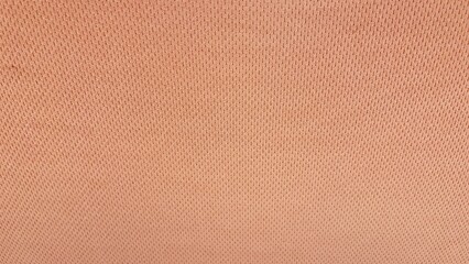 A textured fabric with a seamless pattern featuring a natural, rough linen or burlap material in...