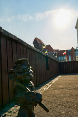 small bronze statue in the streets of Gdansk, Poland.