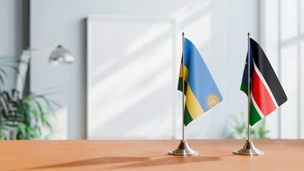 FLAGS OF RWANDA AND SOUTH SUDAN ON TABLE